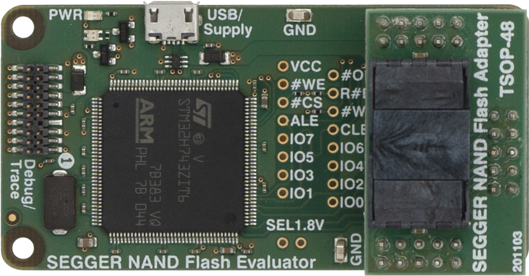 NAND Flash Evaluator This image shows a SEGGER NAND Flash Evaluator circuit board featuring an ARM microcontroller and various pins for connections. It includes labels for power, ground, and I/O function. The design is primarily green with some black components and clear markings indicating the board's use and specifications.