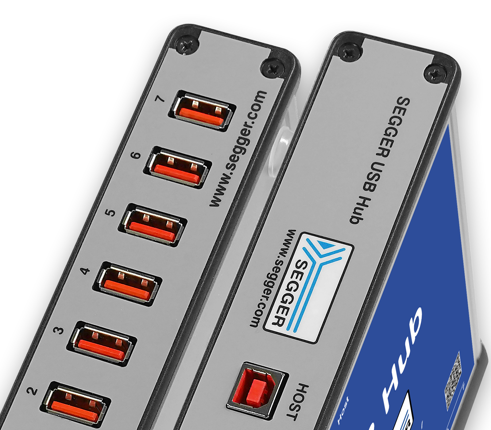 SEGGER USB Hub-7 Image features a SEGGER USB Hub with multiple USB ports. The hub has seven ports, each with a red insert, and is labeled with "HOST" and "SEGGER USB Hub" on the side. The device is designed for connecting multiple USB devices.