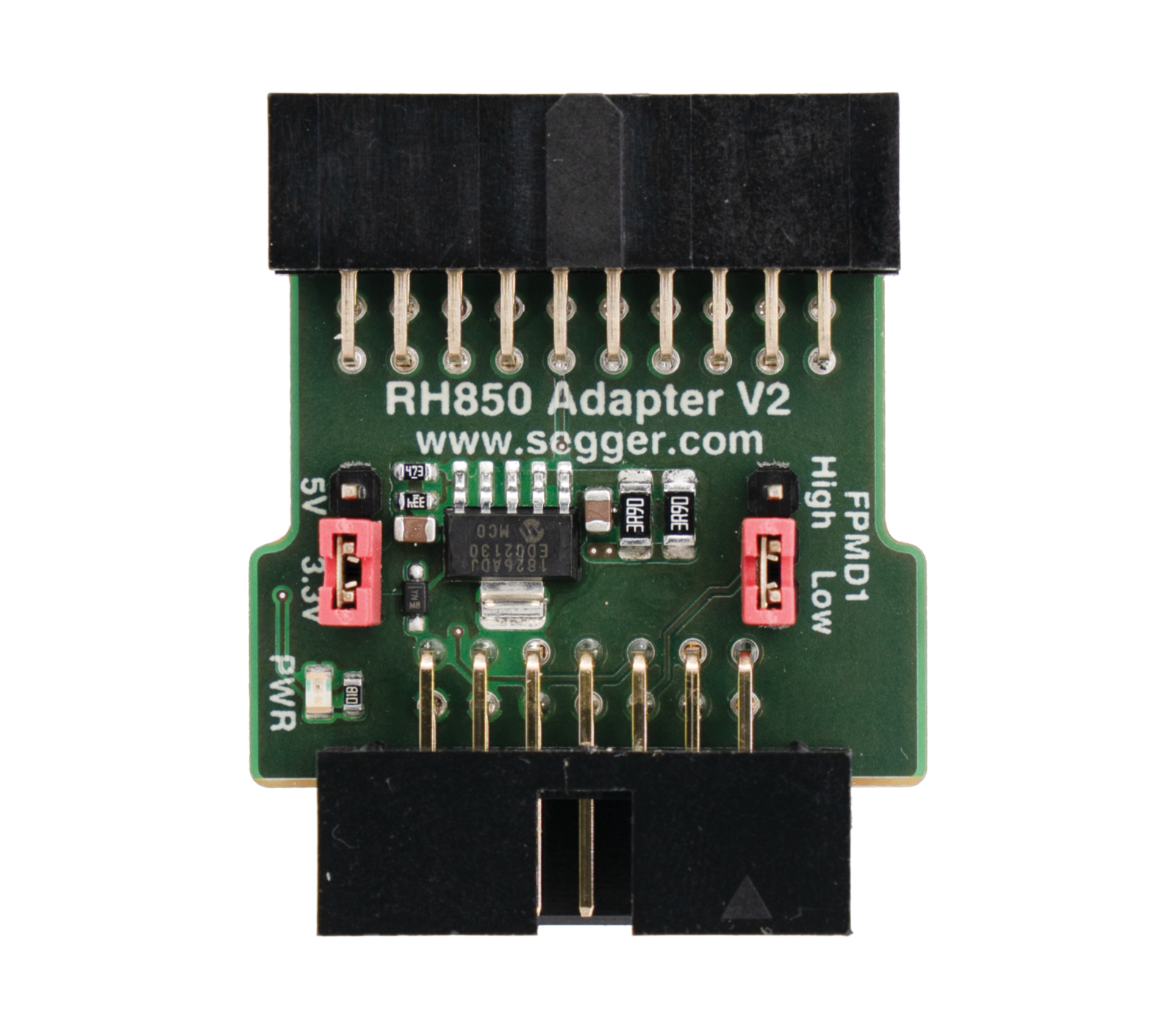 Image of an RH850 Adapter V2 circuit board. It features various electronic components, including connectors and a microchip, set against a green background. The layout includes labeled pins and switches for power and mode selection, designed for interfacing with RH850 microcontrollers.